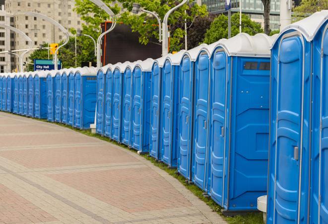 colorful portable restrooms available for rent at a local fair or carnival in Crosby, TX